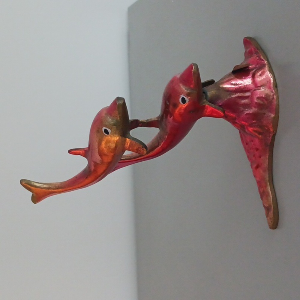 Vintage brass dolphins
